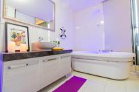 a white bathroom with a sink and a tub and a sink at 宜蘭F1包棟 villa in Wujie