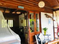 a bedroom with a bed and a door with a window at Oon Lee Bungalows in Ko Jum