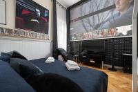 Posteľ alebo postele v izbe v ubytovaní apartamenty kamienica