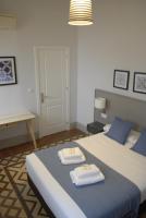La Perla Granada Suitesにあるベッド
