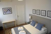 La Perla Granada Suitesにあるベッド