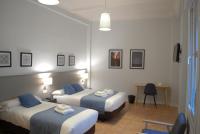 La Perla Granada Suitesにあるベッド
