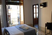 La Perla Granada Suitesにあるベッド