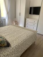 A bed or beds in a room at Verdi appartment