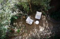 an overhead view of two white chairs on the ground at Le Mas Fraissinet in Saint-Jean-de-Valériscle