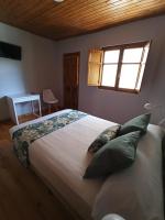A bed or beds in a room at LA CAPILLA
