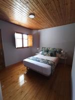 A bed or beds in a room at LA CAPILLA