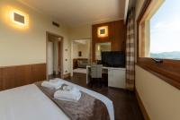 A bed or beds in a room at Hotel Ristorante San Carlo