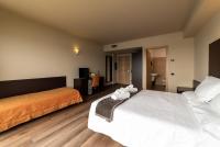 A bed or beds in a room at Hotel Ristorante San Carlo