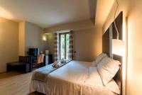 A bed or beds in a room at Hotel Ristorante San Carlo