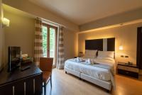 A bed or beds in a room at Hotel Ristorante San Carlo