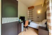 A bed or beds in a room at Hotel Ristorante San Carlo