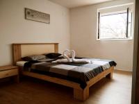 Postel nebo postele na pokoji v ubytování Gecko Apartment