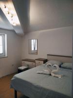Postel nebo postele na pokoji v ubytování Gecko Apartment