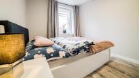 Posteľ alebo postele v izbe v ubytovaní Apartamenty Silvana
