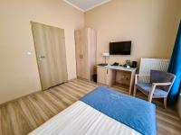 Televízia a/alebo spoločenská miestnosť v ubytovaní Antonińska Hotel & Apartamenty