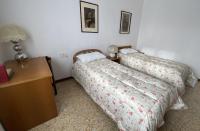 A bed or beds in a room at Villino Carla