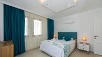 A bed or beds in a room at Hisar 1 - 4 Bedroom Holiday Villa in Hisarönü