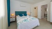 A bed or beds in a room at Hisar 1 - 4 Bedroom Holiday Villa in Hisarönü