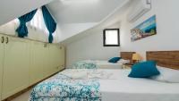 A bed or beds in a room at Hisar 1 - 4 Bedroom Holiday Villa in Hisarönü