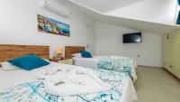 A bed or beds in a room at Hisar 1 - 4 Bedroom Holiday Villa in Hisarönü