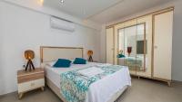 A bed or beds in a room at Hisar 1 - 4 Bedroom Holiday Villa in Hisarönü