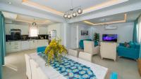 A television and/or entertainment centre at Hisar 1 - 4 Bedroom Holiday Villa in Hisarönü