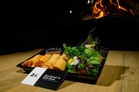 a tray of food on a table with a plate of food at Harbourskitchenhouse@sea in Bredene