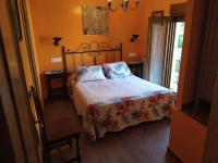 A bed or beds in a room at El Balcon de Peñafiel