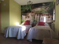 A bed or beds in a room at El Balcon de Peñafiel