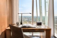 an office with a desk with a book and a lamp at Shangri-La The Shard, London in London