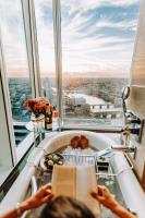 a person reading a book in an observation wheel in an observation tower at Shangri-La The Shard, London in London