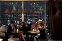 a group of people sitting at tables in a restaurant at Shangri-La The Shard, London in London