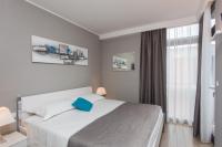 Posteľ alebo postele v izbe v ubytovaní Apartments ZoomZoom