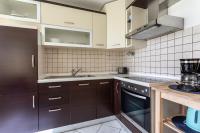 Kuchnia lub aneks kuchenny w obiekcie Apartment Magic Garden