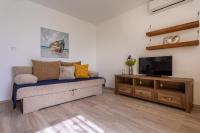 Telewizja i/lub zestaw kina domowego w obiekcie Apartment Magic Garden