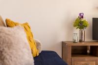 Telewizja i/lub zestaw kina domowego w obiekcie Apartment Magic Garden