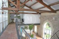 a view of therium of a building with wooden beams at Chambres d&#39;hôtes la Soulenque Luxury B &amp; B in Capestang