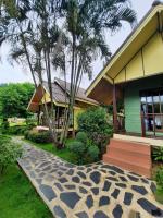 a house with a stone walkway in front of it at Koh Chang Bailan Beach Resort in Ko Chang