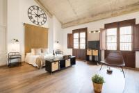 Postel nebo postele na pokoji v ubytování Santiago Premium Loft III