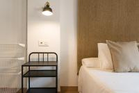 Postel nebo postele na pokoji v ubytování Santiago Premium Loft III