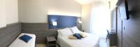 A bed or beds in a room at Hotel Mediterranée