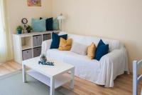 Łóżko lub łóżka w pokoju w obiekcie Azúr Apartman Keszthely