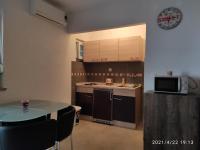 Kuchyňa alebo kuchynka v ubytovaní Apartmani QUATTRO