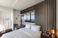 Postel nebo postele na pokoji v ubytování THE WAVE TWIN VILLA 1 KATHISMA BEACH Lefkada