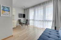 Televízia a/alebo spoločenská miestnosť v ubytovaní Dom & House - Apartamenty Sunrise