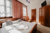 Postel nebo postele na pokoji v ubytování Hotel U Lípy