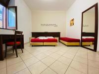 Łóżko lub łóżka w pokoju w obiekcie Mamamia #Lipari