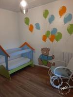 a room with a teddy bear on the wall with balloons at Gite au cœur du Luberon in Goult