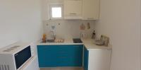 Kuchyňa alebo kuchynka v ubytovaní Apartman Lapis
